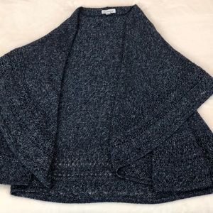 Sweater that flows; no buttons. Cotton, rayon, acrylic.